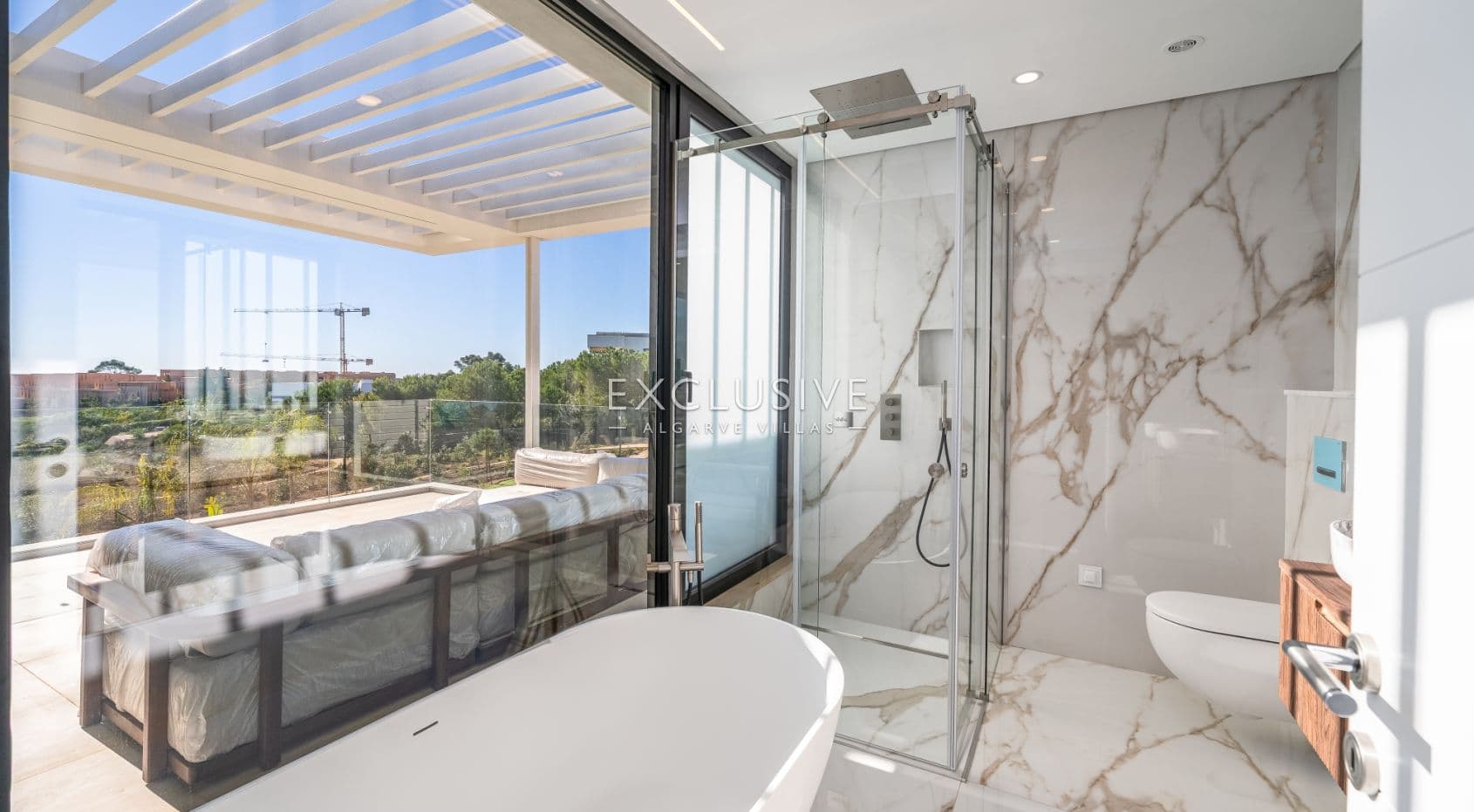 Buy 4 bedroom contemporary villa with golf and ocean views on Palmares golf course Lagos Algarve